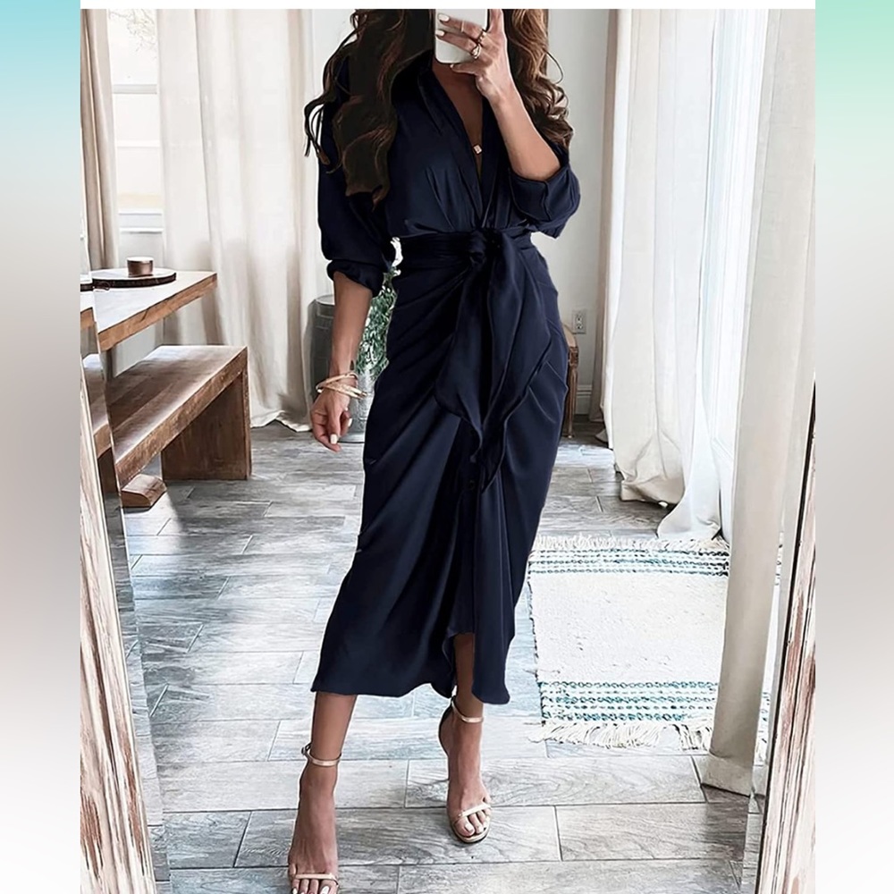 Women’s wrap dress in dark navy. New with tags never worn. Size large.